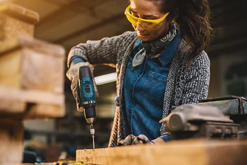 Monnick Supply - Woman Using Power Drill